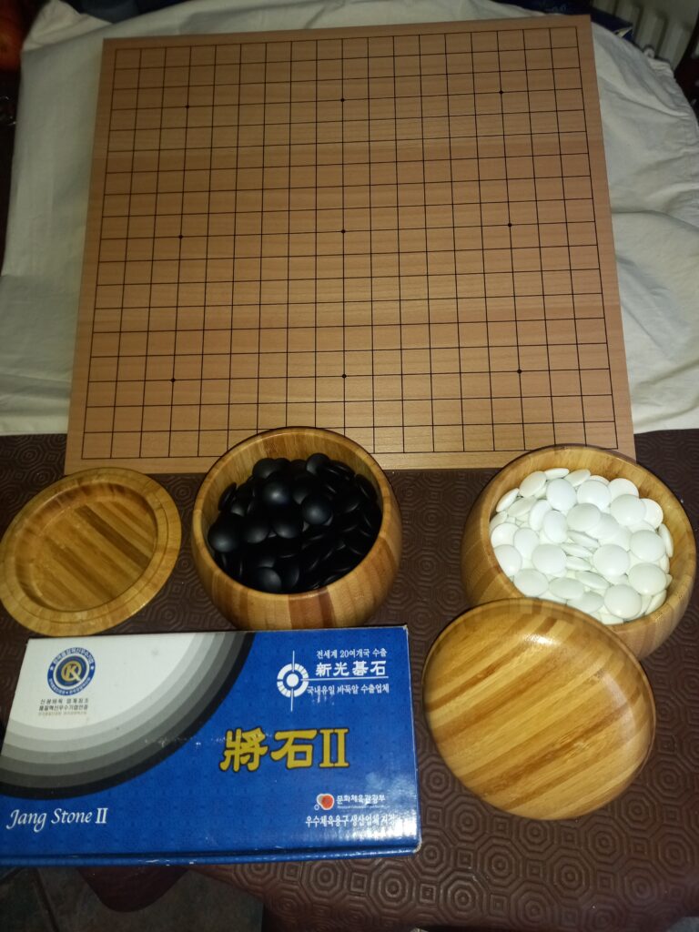 Go board and stones in bowls
